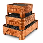 Copper coated table grill used in hotels and restaurants for serving sizzling BBQ and grilled dishes.