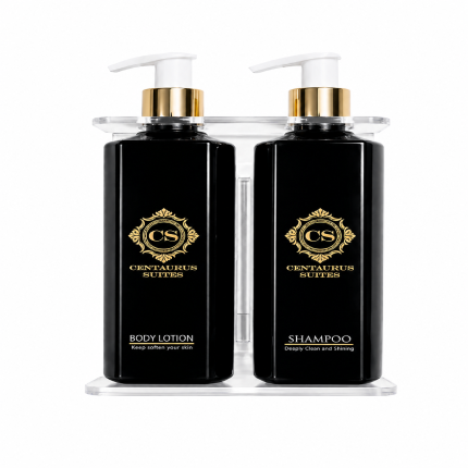 Wall-mounted bathroom liquid dispenser set with shampoo, body lotion, and hand wash bottles in a modern holder on a clean background